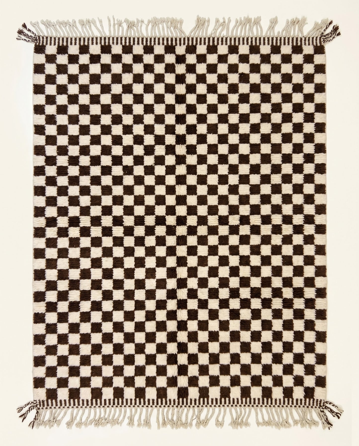High pile Beni Ourain Moroccan rug by NURA featuring a bold chocolate brown and cream checkerboard pattern in plush wool.