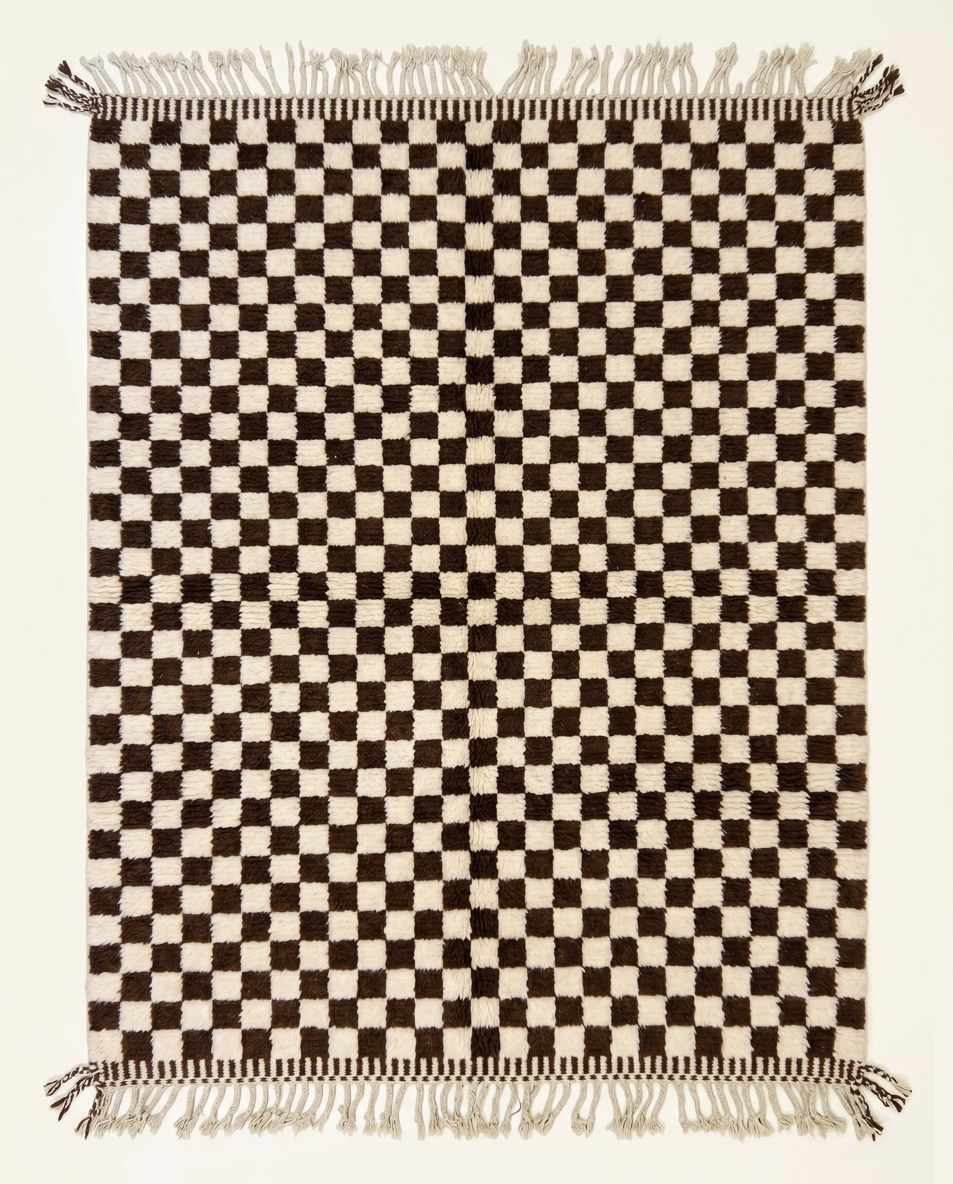 High pile Beni Ourain Moroccan rug by NURA featuring a bold chocolate brown and cream checkerboard pattern in plush wool.