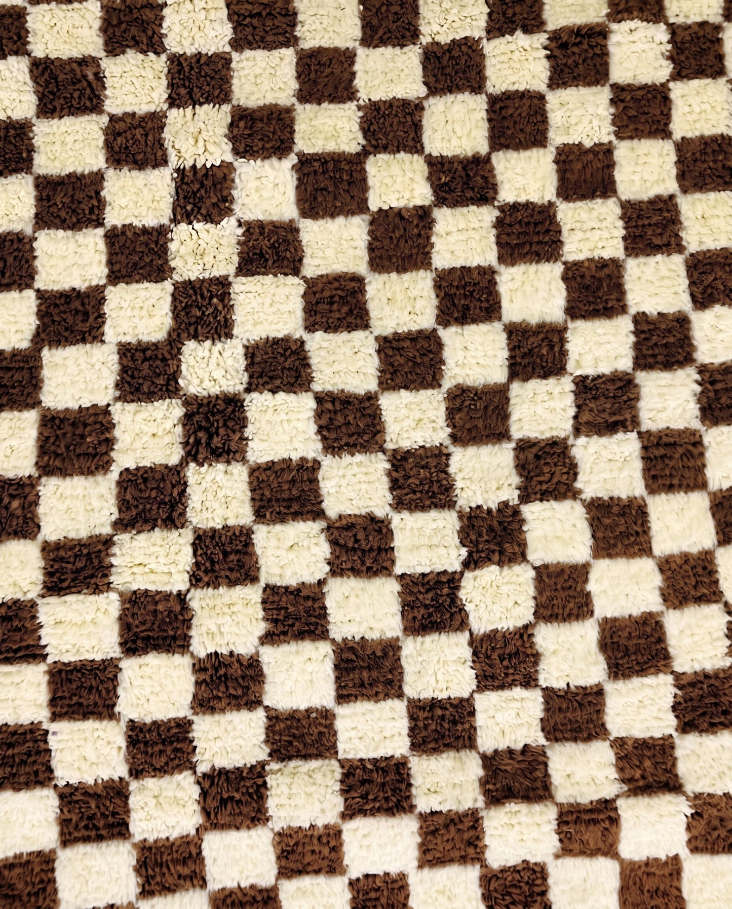 MAJIDA Beni Ourain chocolate checker grid Moroccan rug close-up showing hand-knotted wool texture and pile detail 1, by NURA
