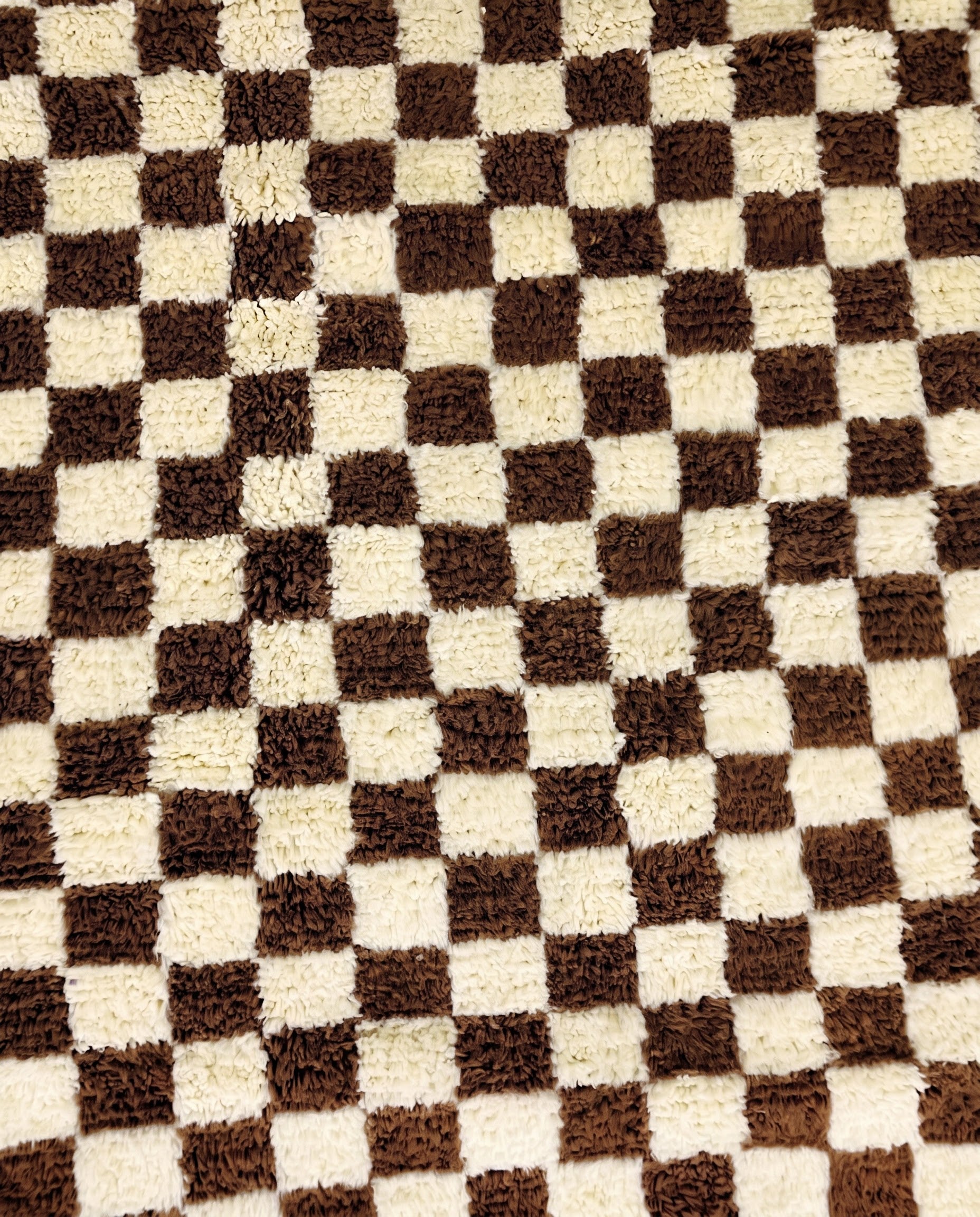 MAJIDA Beni Ourain chocolate checker grid Moroccan rug close-up showing hand-knotted wool texture and pile detail 1, by NURA