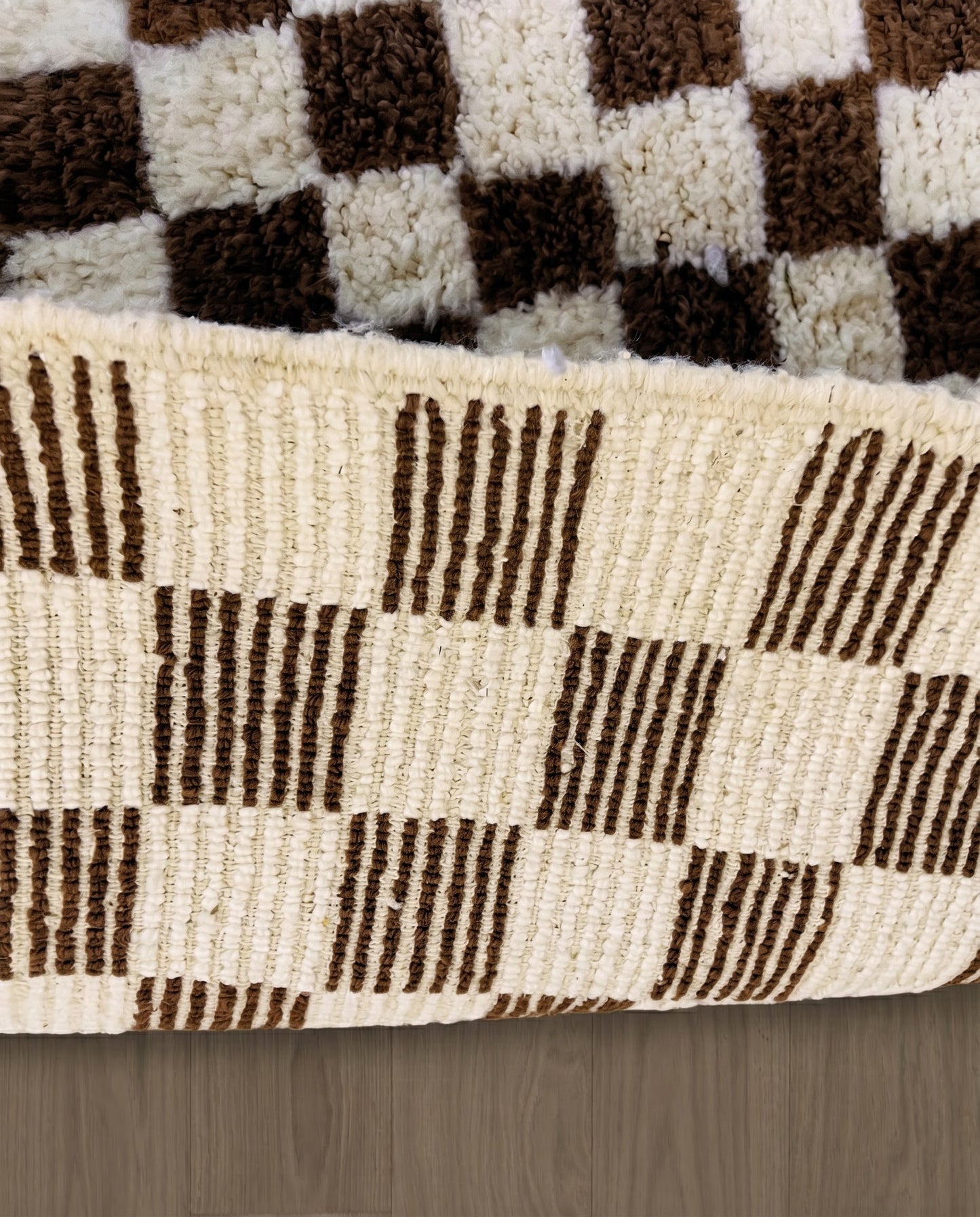 MAJIDA Beni Ourain chocolate checker grid Moroccan rug close-up showing hand-knotted wool texture and pile detail 2, by NURA