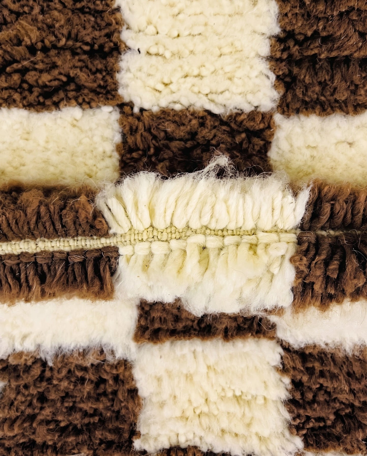 MAJIDA Beni Ourain chocolate checker grid Moroccan rug close-up showing hand-knotted wool texture and pile detail 3, by NURA