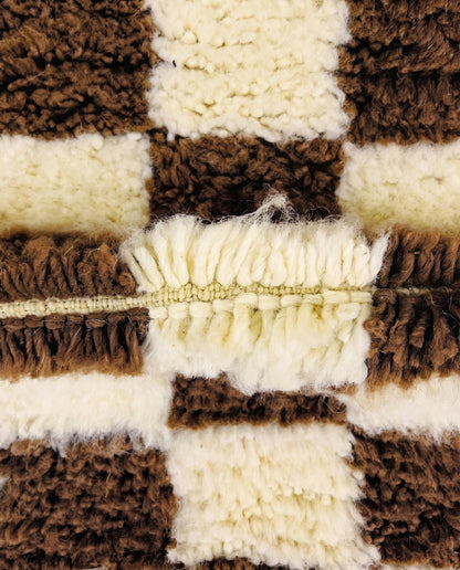 MAJIDA Beni Ourain chocolate checker grid Moroccan rug close-up showing hand-knotted wool texture and pile detail 3, by NURA