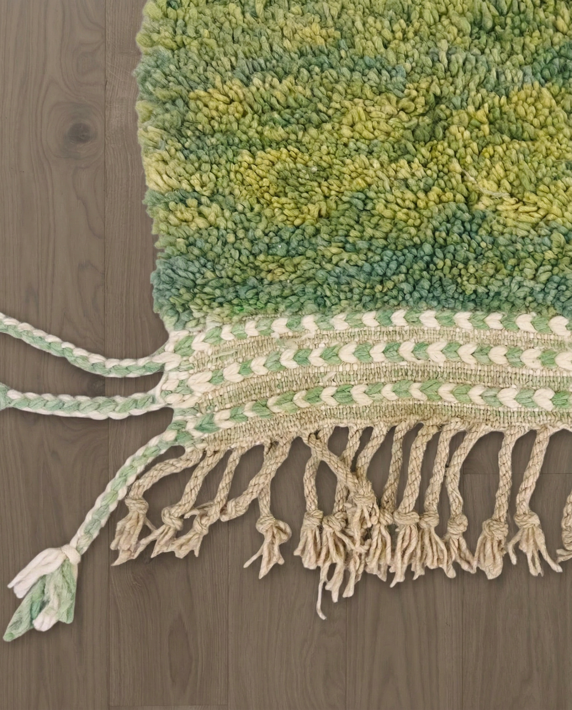 MANAL Mrirt sage asymmetrical color block Moroccan rug close-up of hand-tied fringe and kilim band detail 1, by NURA