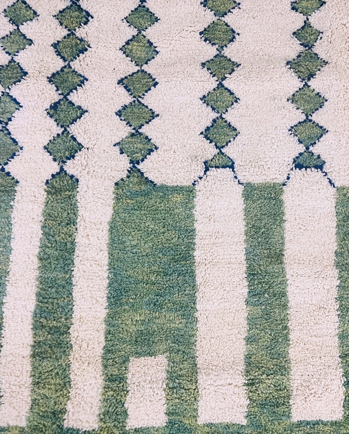 MANAL Mrirt sage asymmetrical color block Moroccan rug close-up showing hand-knotted wool texture and pile detail 1, by NURA