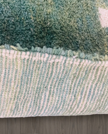 MANAL Mrirt sage asymmetrical color block Moroccan rug close-up showing hand-knotted wool texture and pile detail 2, by NURA
