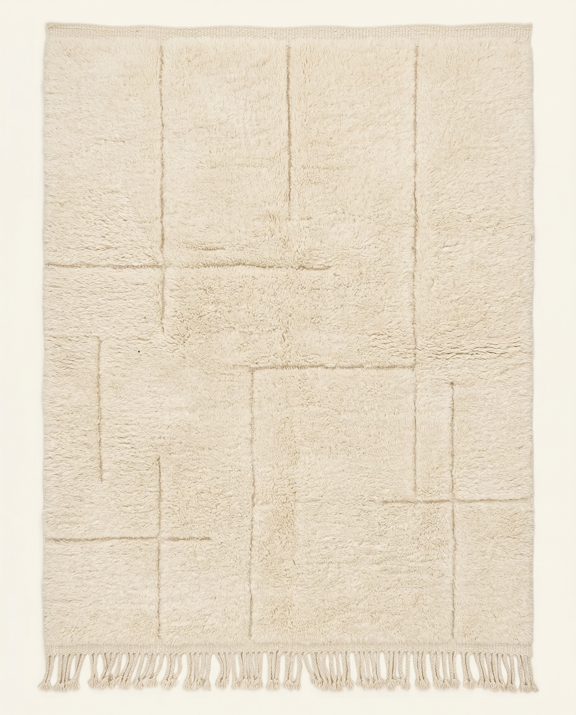 Plush cream Beni Ourain Moroccan rug with a modern carved geometric grid and thick high pile, by NURA.