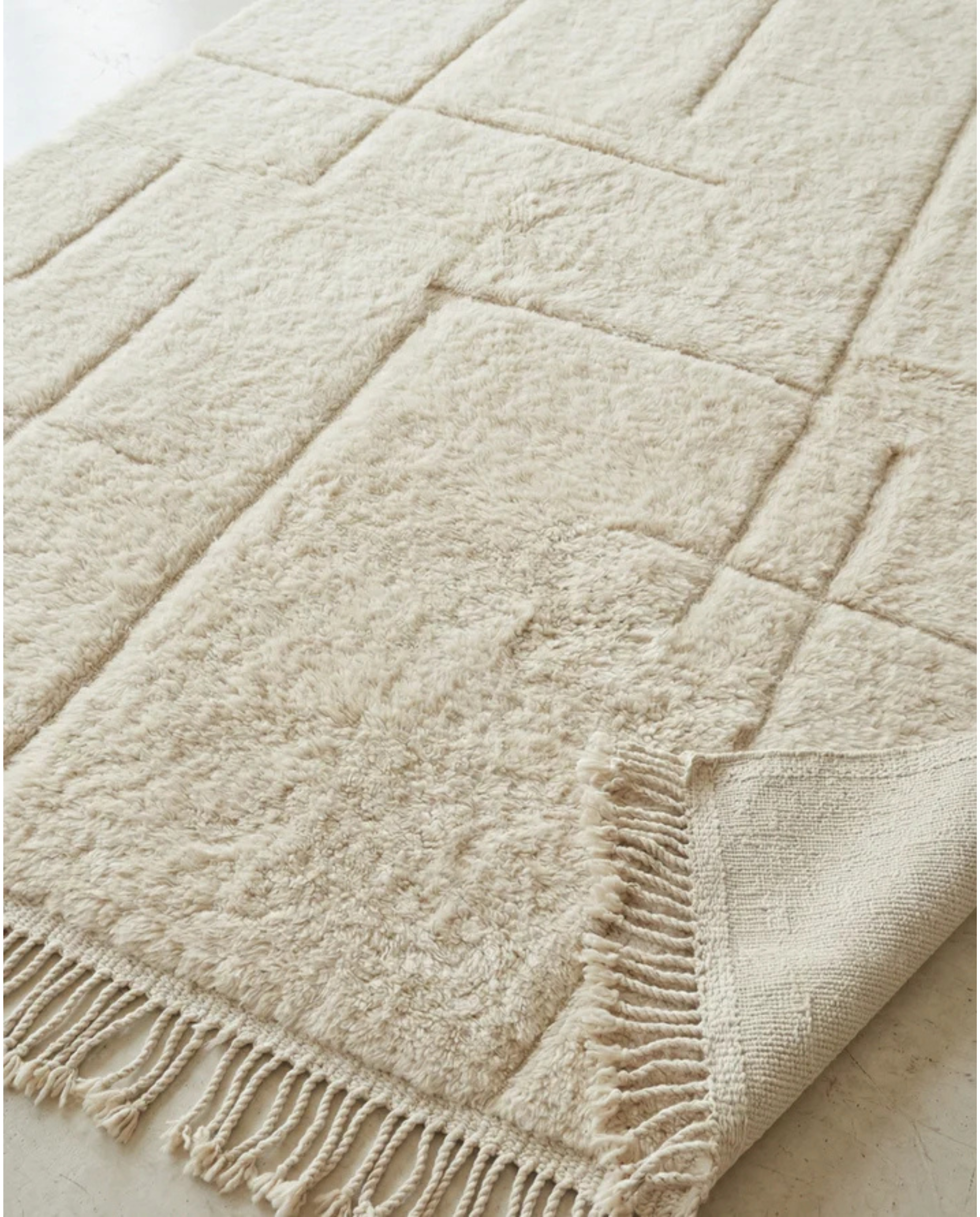 MAYA Beni Ourain cream carved geometric grid Moroccan rug close-up showing hand-knotted wool texture and pile detail 2, by NURA
