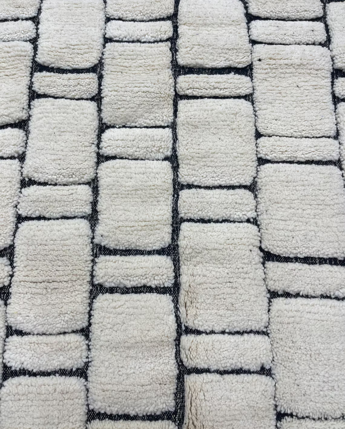 MERIEM Beni Ourain ivory abstract block grid Moroccan rug close-up showing hand-knotted wool texture and pile detail 1, by NURA