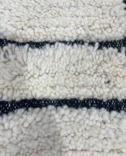 MERIEM Beni Ourain ivory abstract block grid Moroccan rug close-up showing hand-knotted wool texture and pile detail 2, by NURA
