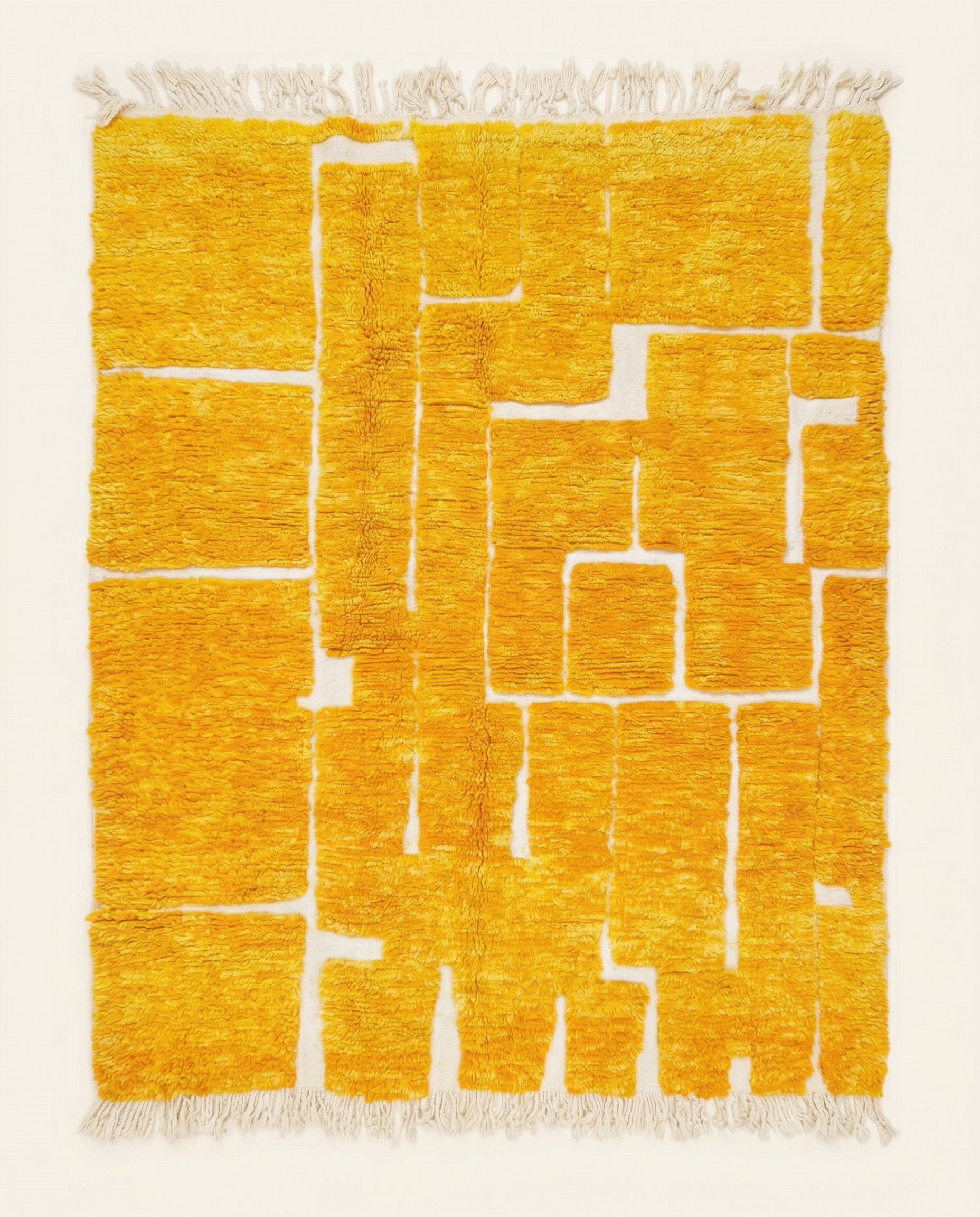 Plush saffron and cream Beni Ourain Moroccan rug with a bold raised block grid and high-low pile texture, by NURA.