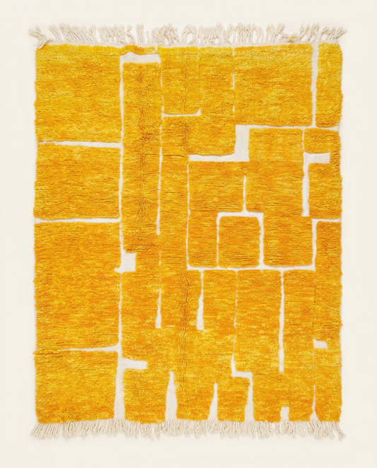 Plush saffron and cream Beni Ourain Moroccan rug with a bold raised block grid and high-low pile texture, by NURA.