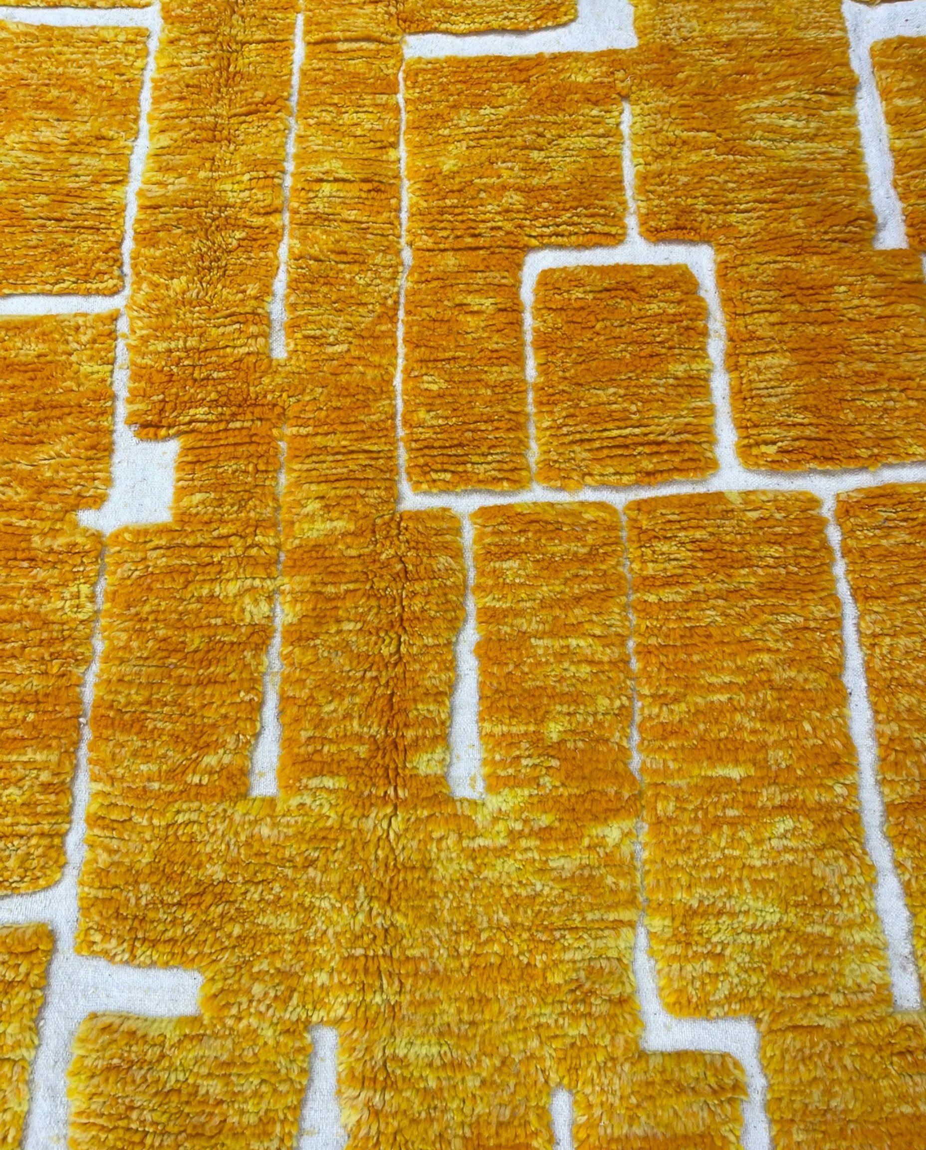MIRA Beni Ourain saffron raised block grid Moroccan rug close-up showing hand-knotted wool texture and pile detail, by NURA