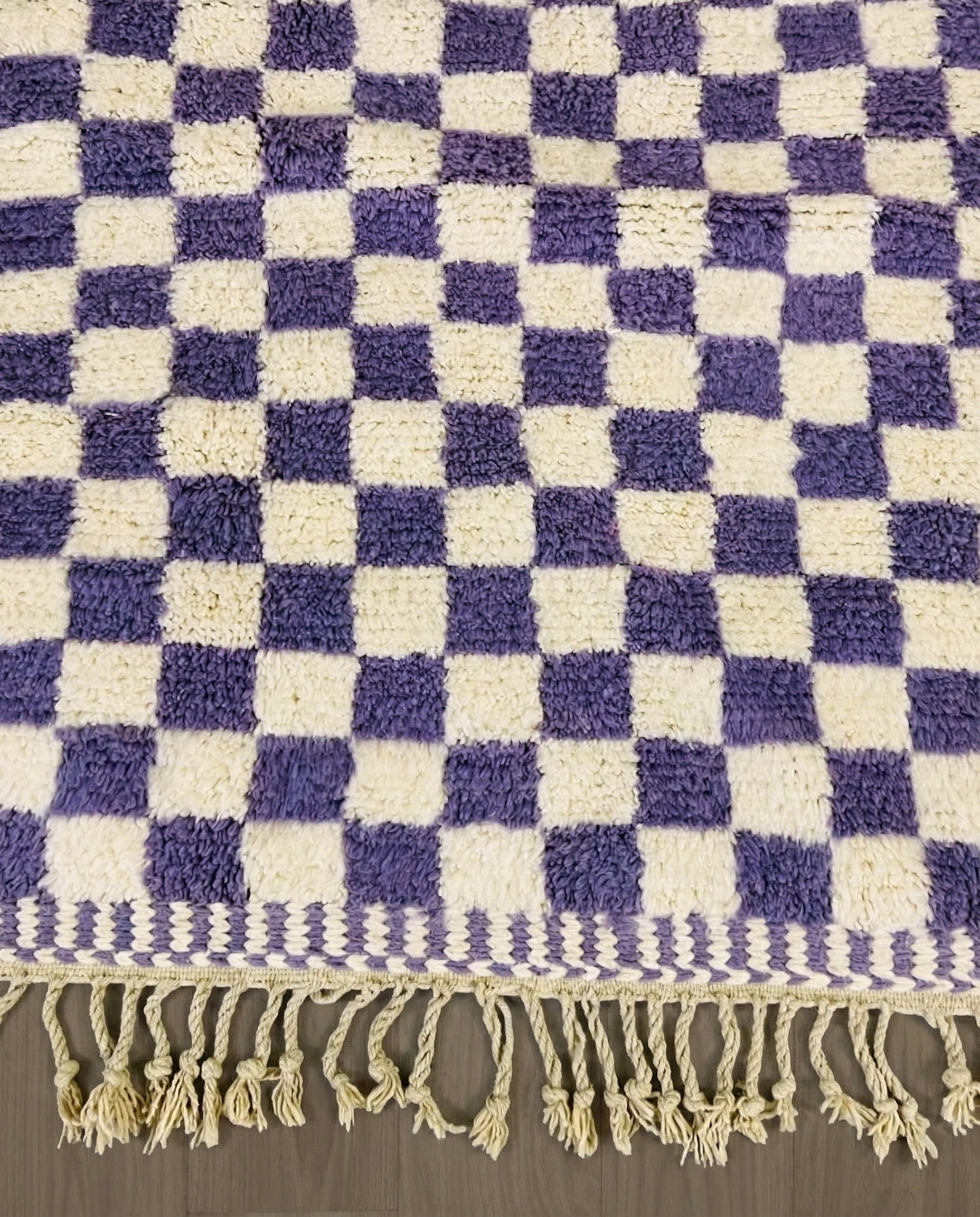MOUNA Beni Ourain violet checker grid Moroccan rug close-up of hand-tied fringe and kilim band detail, by NURA