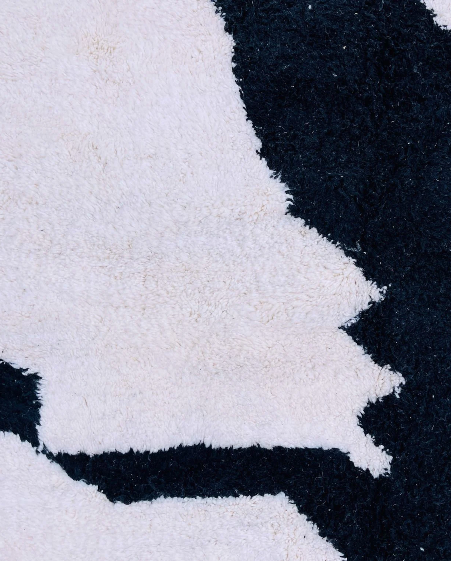 MOUNIA Beni Ourain ivory abstract color block Moroccan rug close-up showing hand-knotted wool texture and pile detail 1, by NURA
