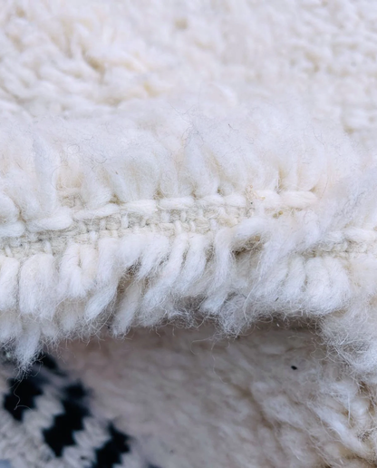 MOUNIA Beni Ourain ivory abstract color block Moroccan rug close-up showing hand-knotted wool texture and pile detail 2, by NURA