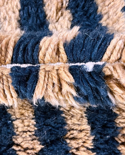 NABILA Beni Ourain black horizontal stripes Moroccan rug close-up showing hand-knotted wool texture and pile detail 2, by NURA