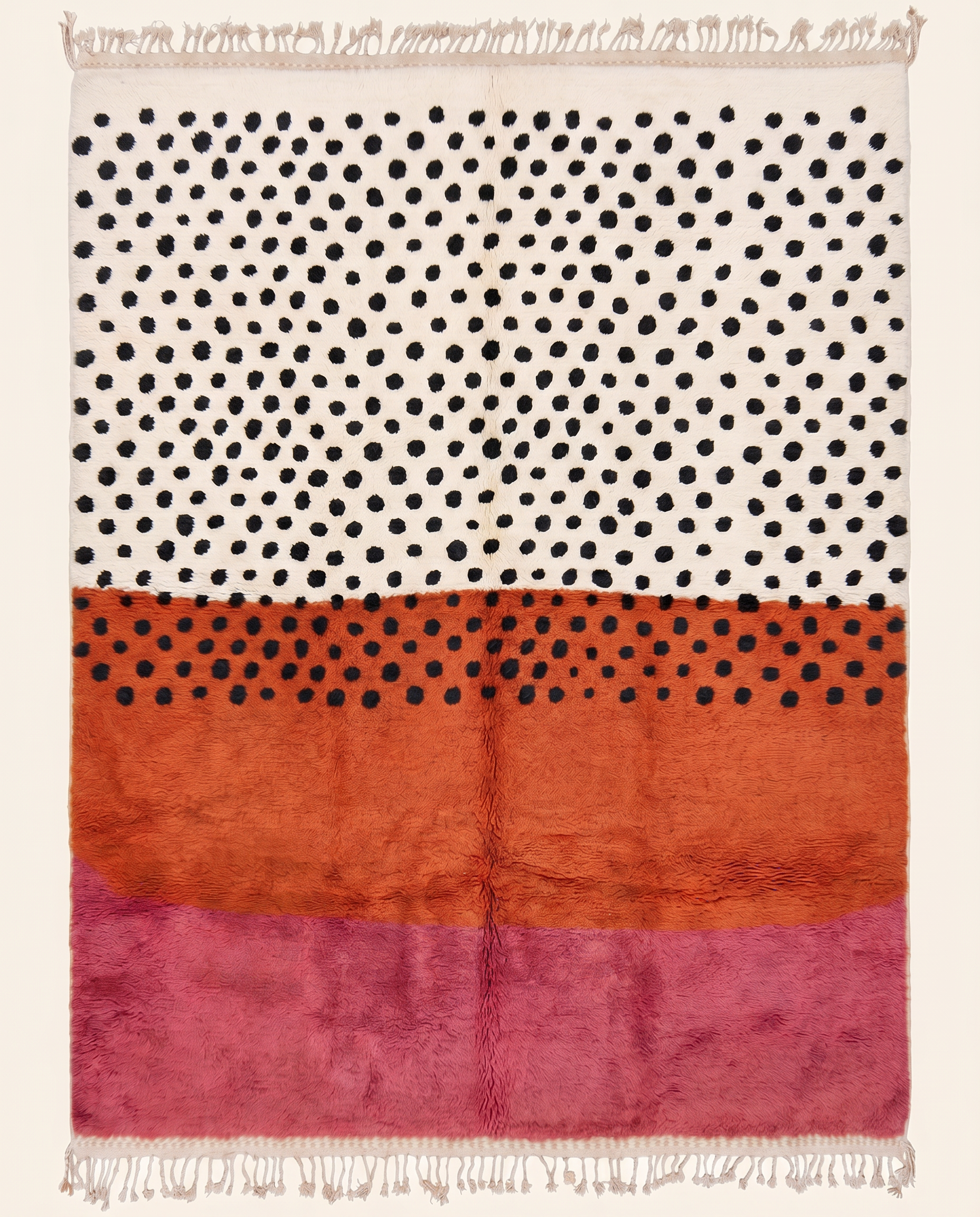 Bold color-blocked Azilal Moroccan rug by NURA featuring plush cream, terracotta, and pink bands with scattered black dots.