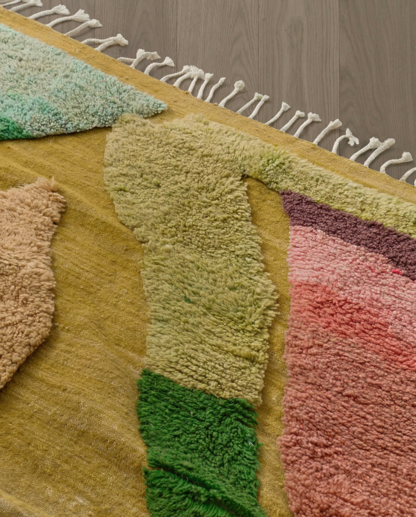 NAIMA Azilal mustard organic abstract field Moroccan rug close-up of hand-tied fringe and kilim band detail, by NURA