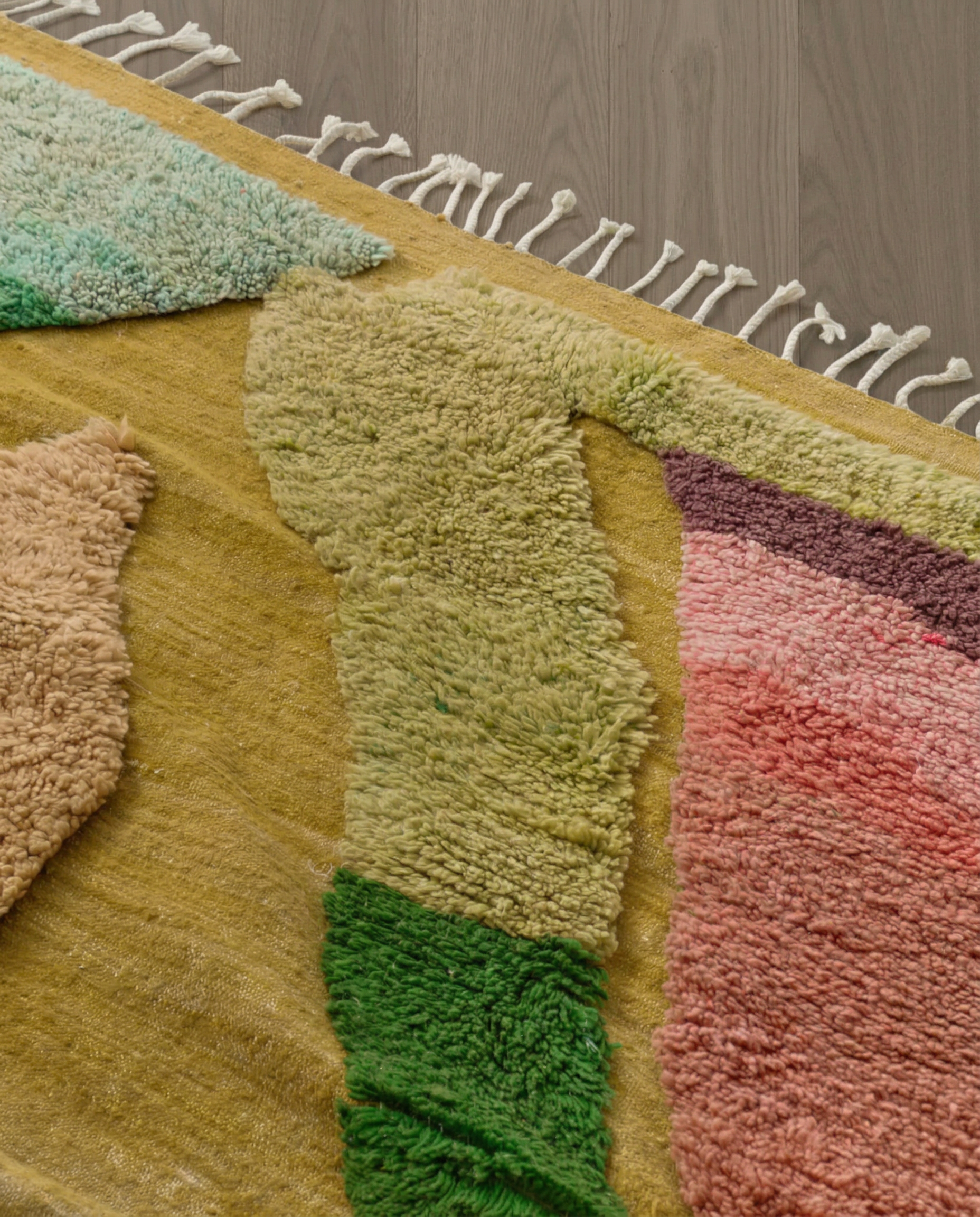 NAIMA Azilal mustard organic abstract field Moroccan rug close-up of hand-tied fringe and kilim band detail, by NURA