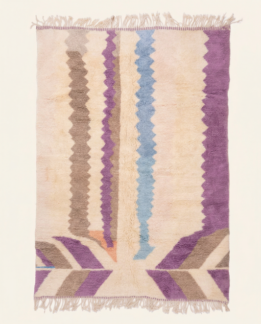 Plush cream Azilal Moroccan rug with playful vertical zigzag bands in purple and powder blue, by NURA.
