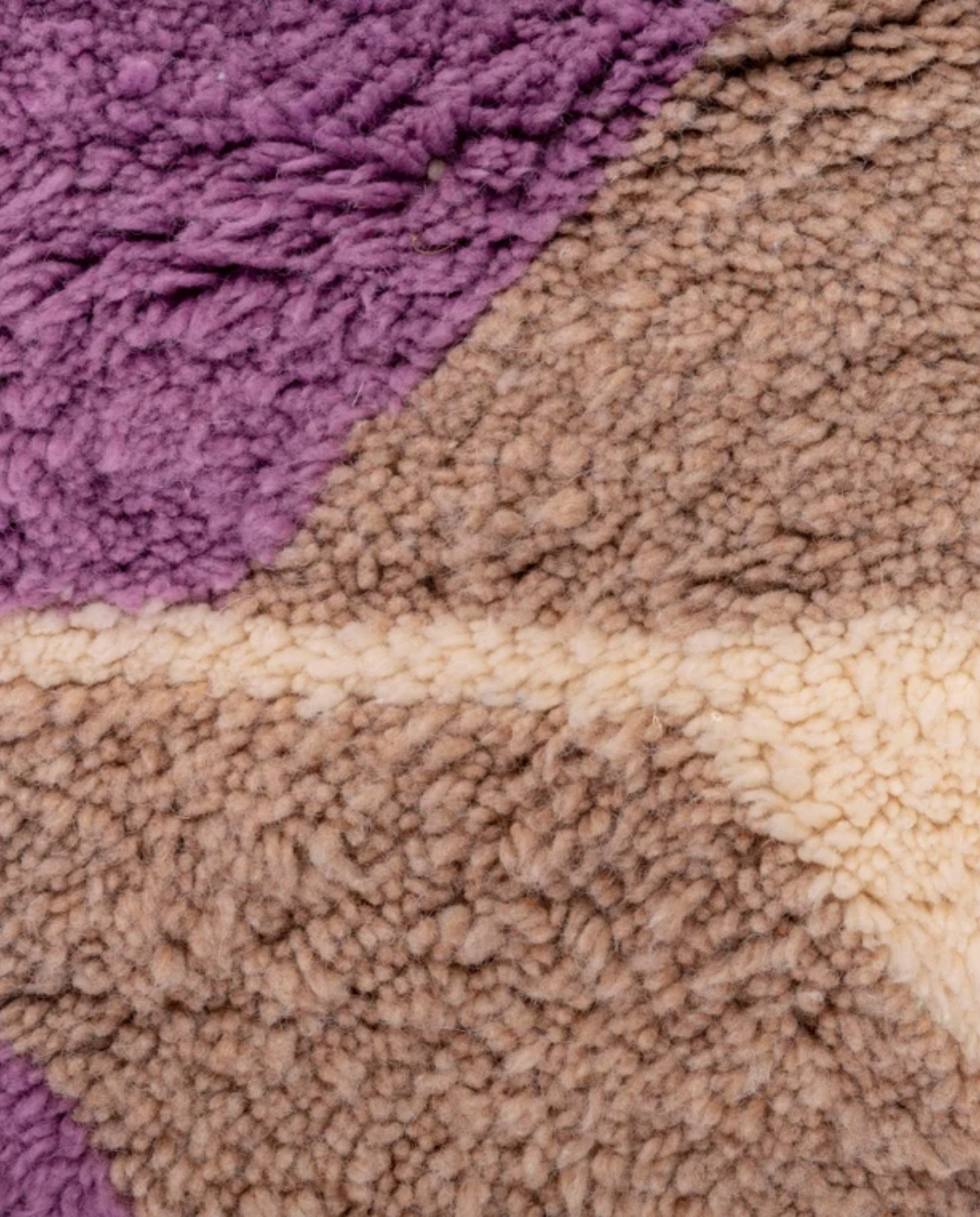 NAJAT Azilal cream zigzag vertical bands Moroccan rug close-up showing hand-knotted wool texture and pile detail, by NURA