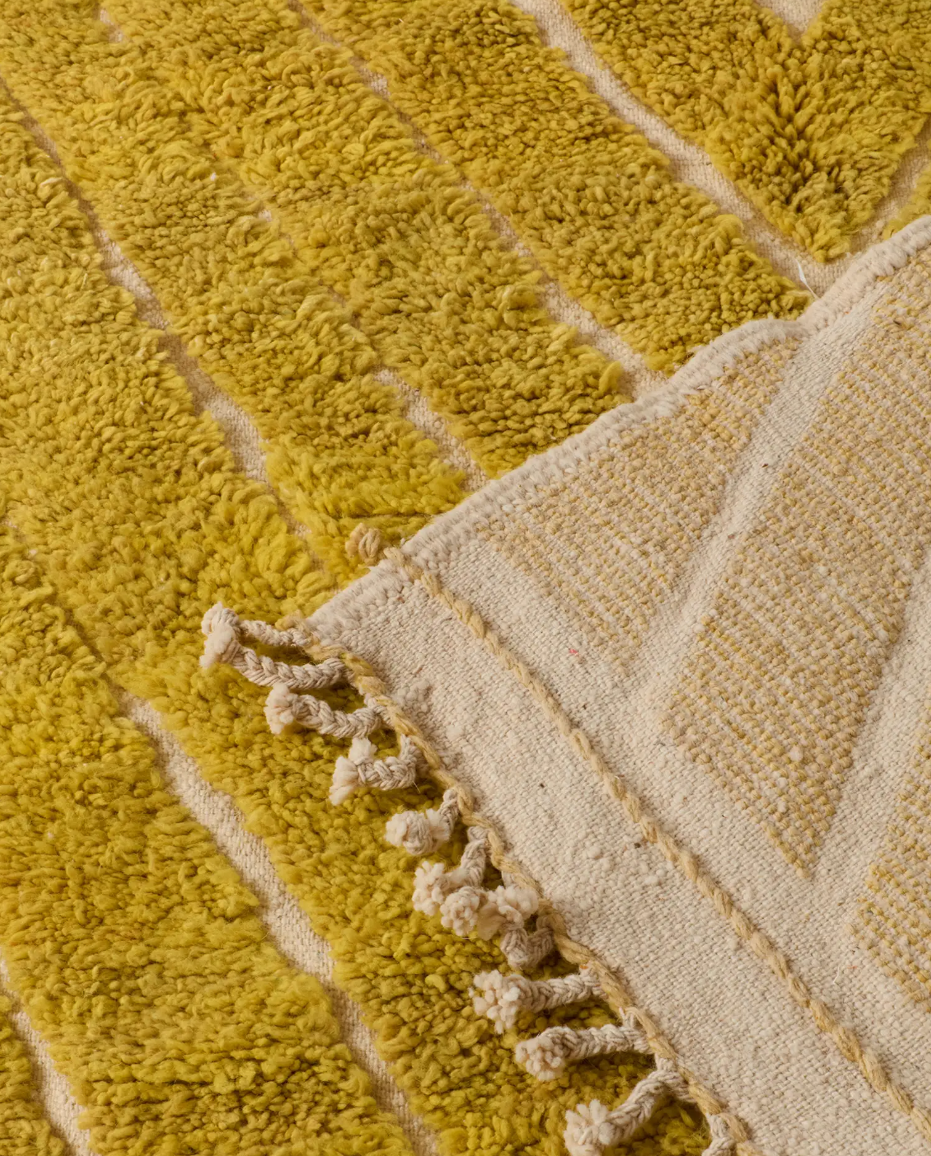NAJWA Azilal mustard textured chevron Moroccan rug back view showing traditional handwoven construction, by NURA