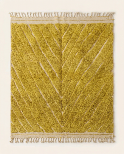 Plush mustard yellow Azilal Moroccan rug with a carved high-low chevron pattern and natural cream foundation, by NURA.