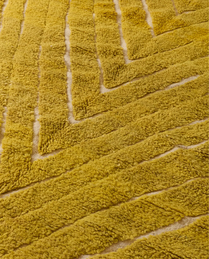 NAJWA Azilal mustard textured chevron Moroccan rug close-up showing hand-knotted wool texture and pile detail, by NURA