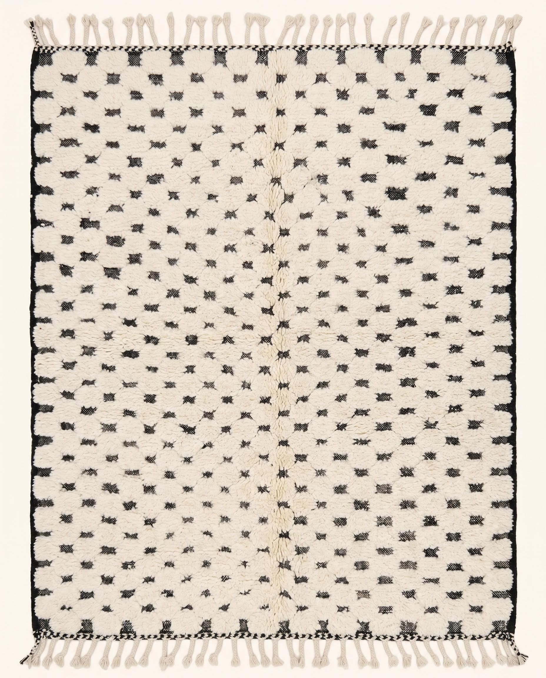 Plush cream Moroccan rug featuring a minimalist black dotted checker grid pattern, hand-knotted in wool by NURA.