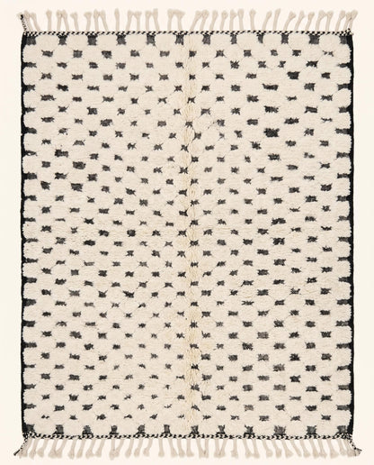 Plush cream Moroccan rug featuring a minimalist black dotted checker grid pattern, hand-knotted in wool by NURA.
