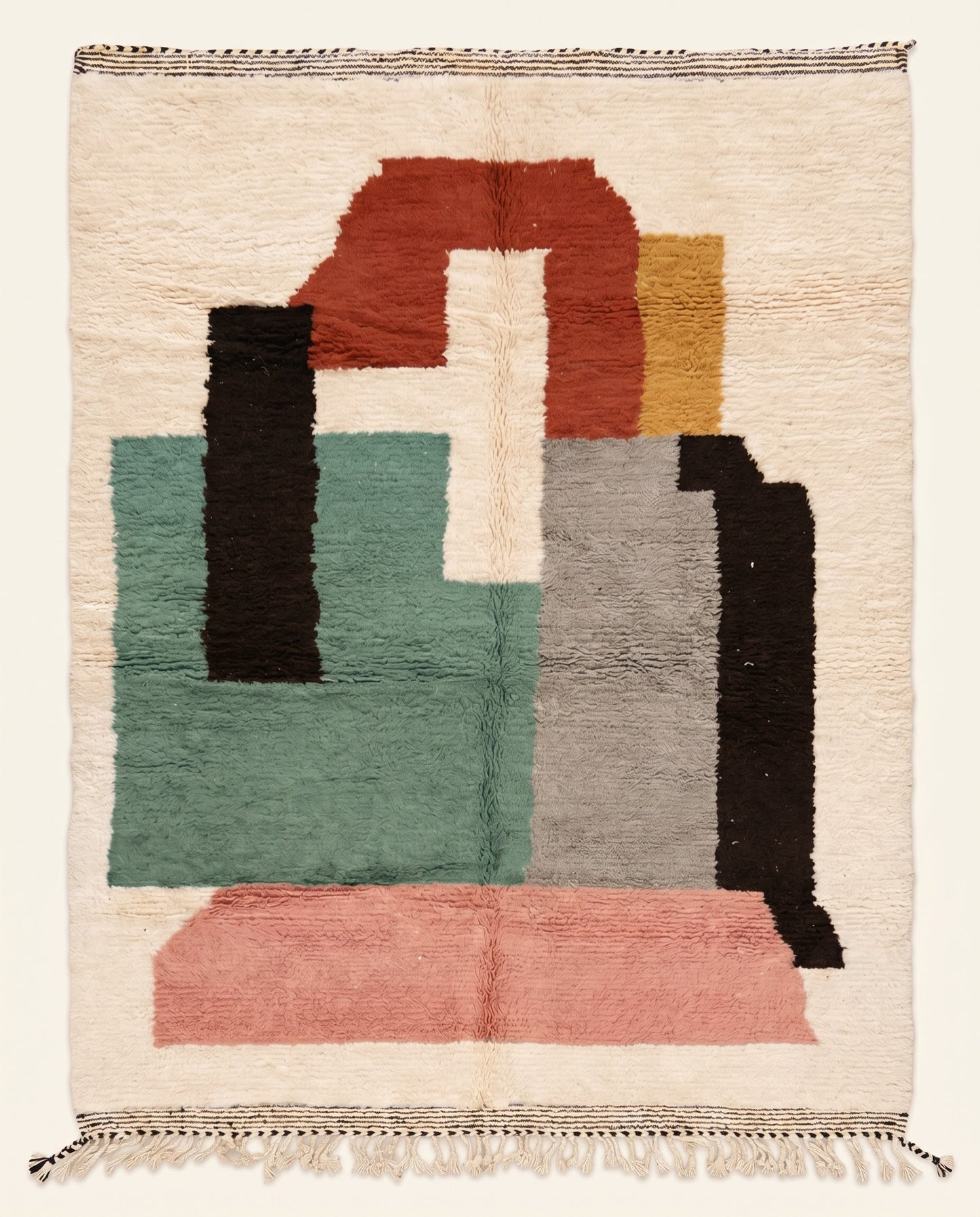 A colorful abstract Azilal Moroccan rug by NURA with bold geometric blocks in teal, pink, and rust on a plush cream wool pile.