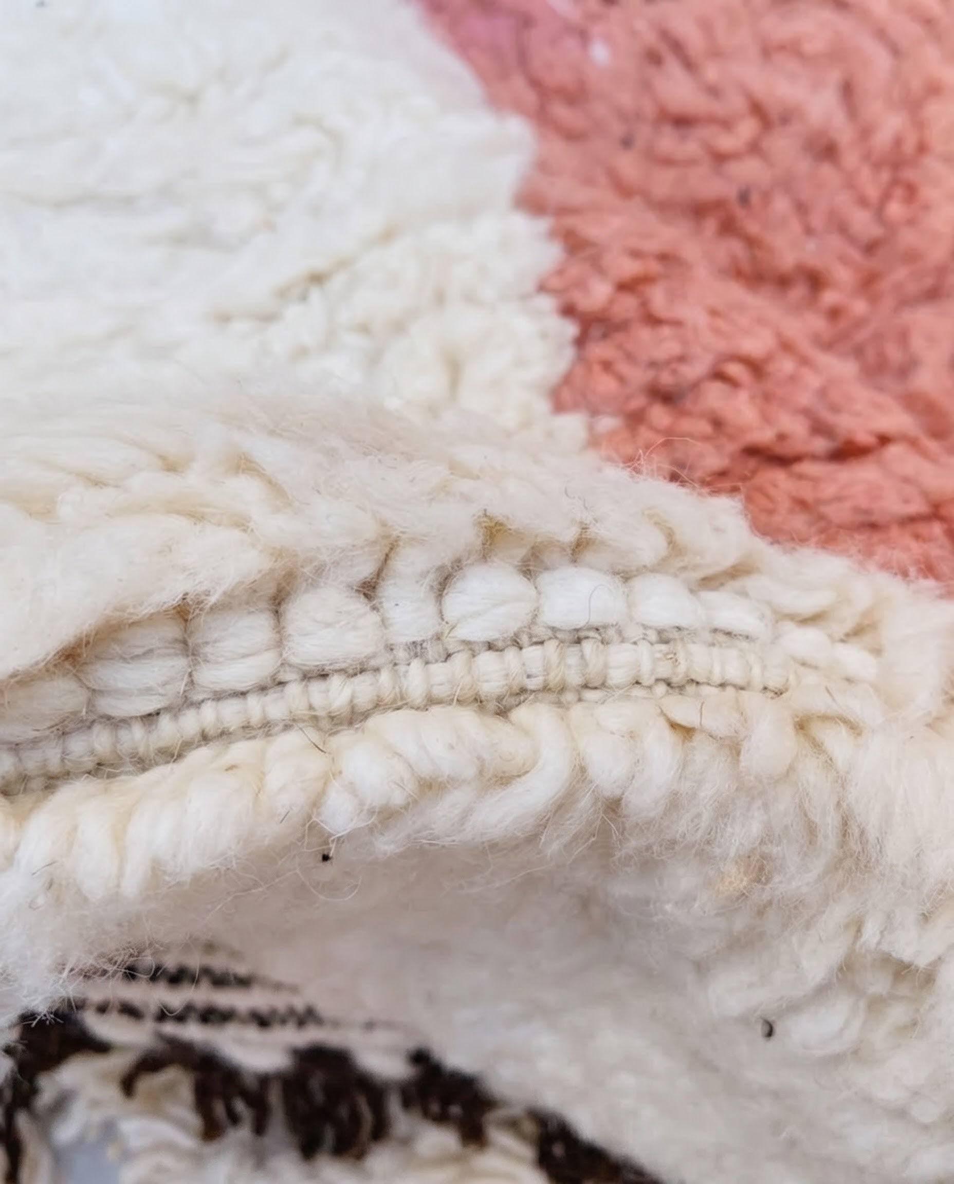 NARIMANE Azilal cream organic abstract Moroccan rug close-up showing hand-knotted wool texture and pile detail 2, by NURA