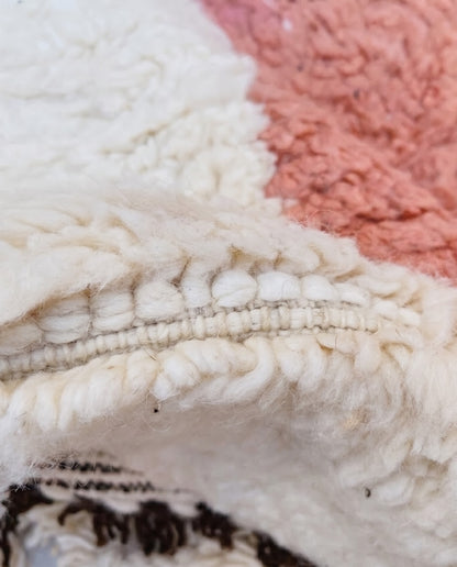 NARIMANE Azilal cream organic abstract Moroccan rug close-up showing hand-knotted wool texture and pile detail 2, by NURA