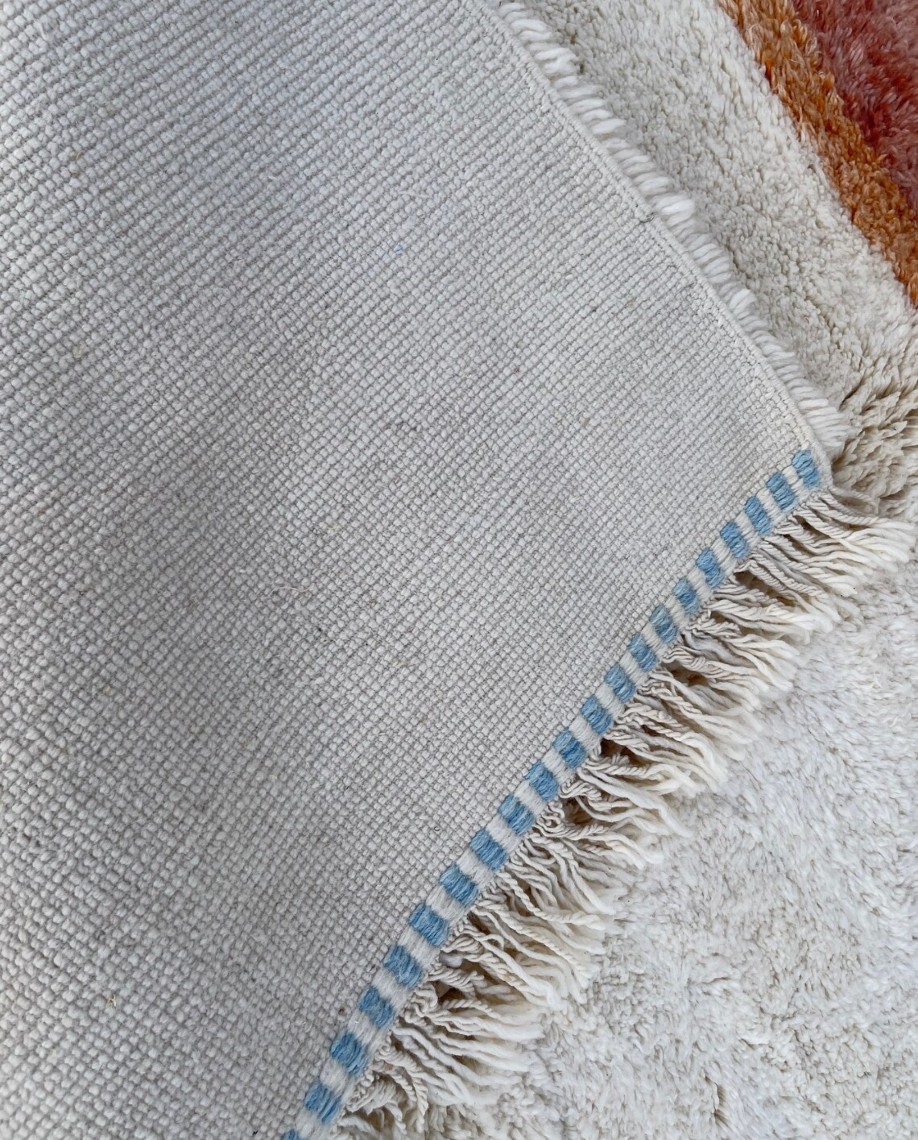 NARJISS Beni Ourain cream abstract color block Moroccan rug back view showing traditional handwoven construction, by NURA