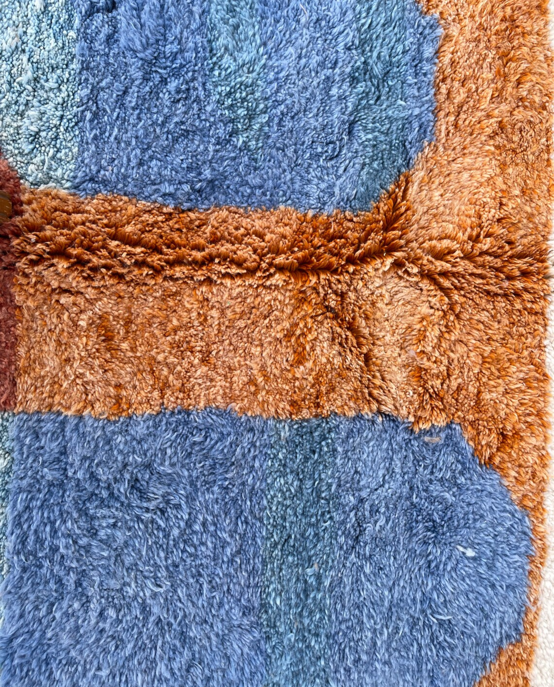 NARJISS Beni Ourain cream abstract color block Moroccan rug close-up showing hand-knotted wool texture and pile detail 1, by NURA