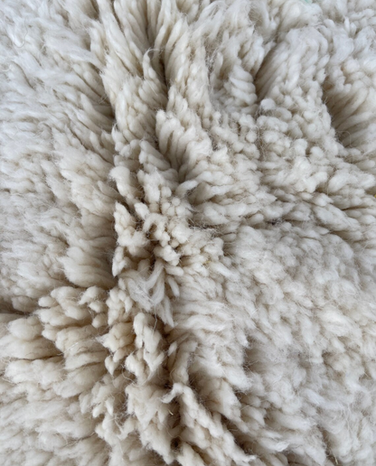 NARJISS Beni Ourain cream abstract color block Moroccan rug close-up showing hand-knotted wool texture and pile detail 2, by NURA