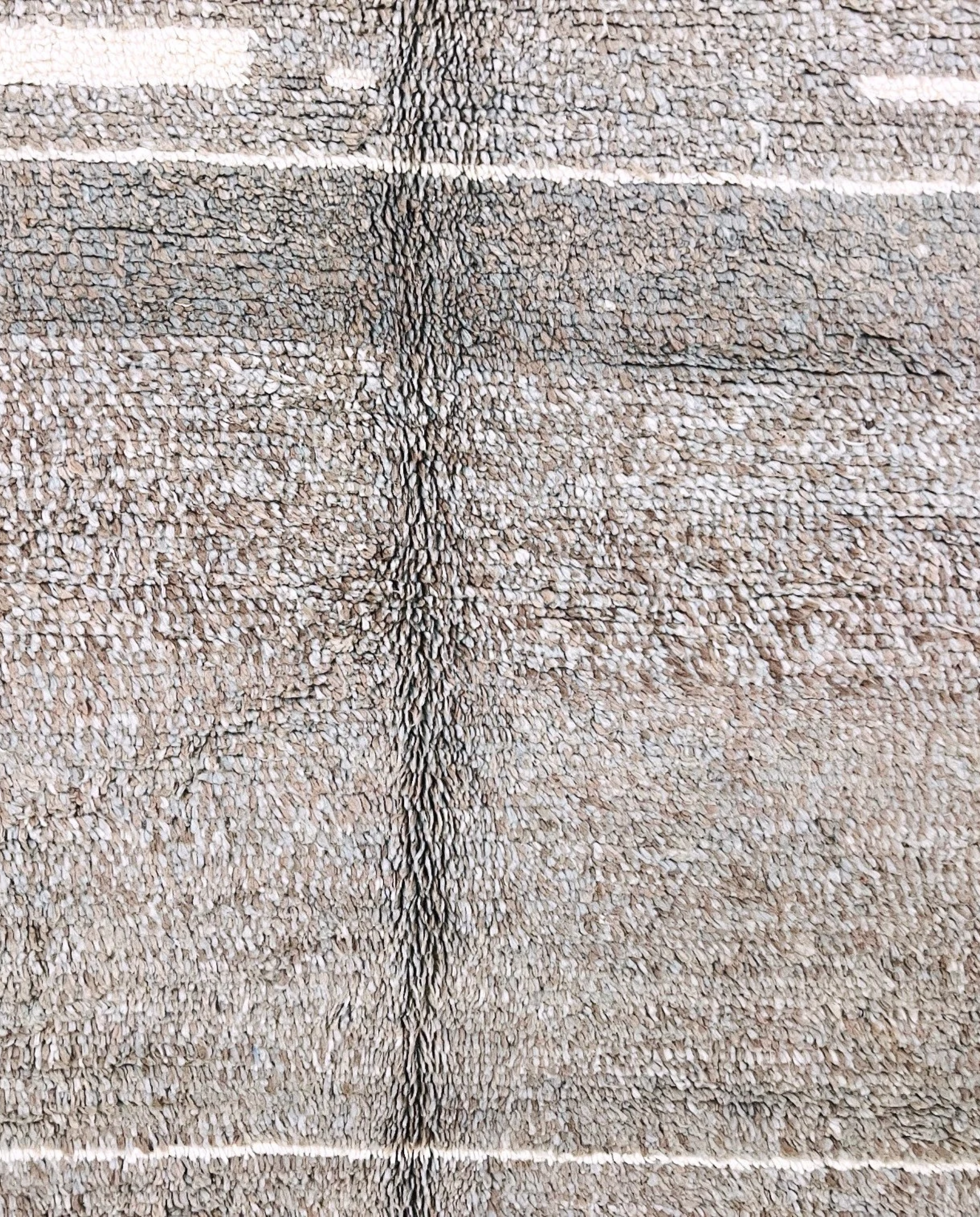 NESRINE Beni Ourain taupe broken stripe Moroccan rug close-up showing hand-knotted wool texture and pile detail 1, by NURA