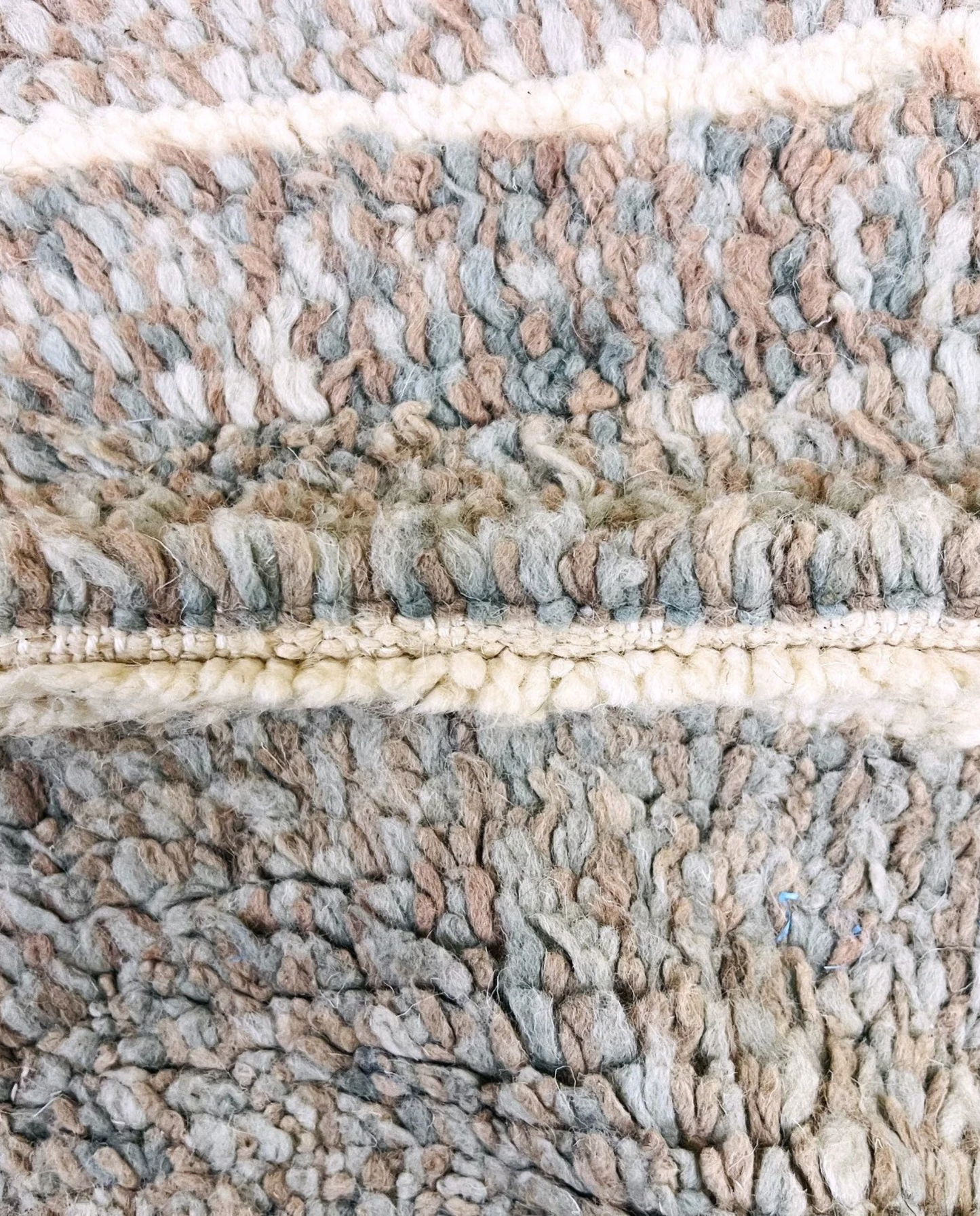 NESRINE Beni Ourain taupe broken stripe Moroccan rug close-up showing hand-knotted wool texture and pile detail 2, by NURA