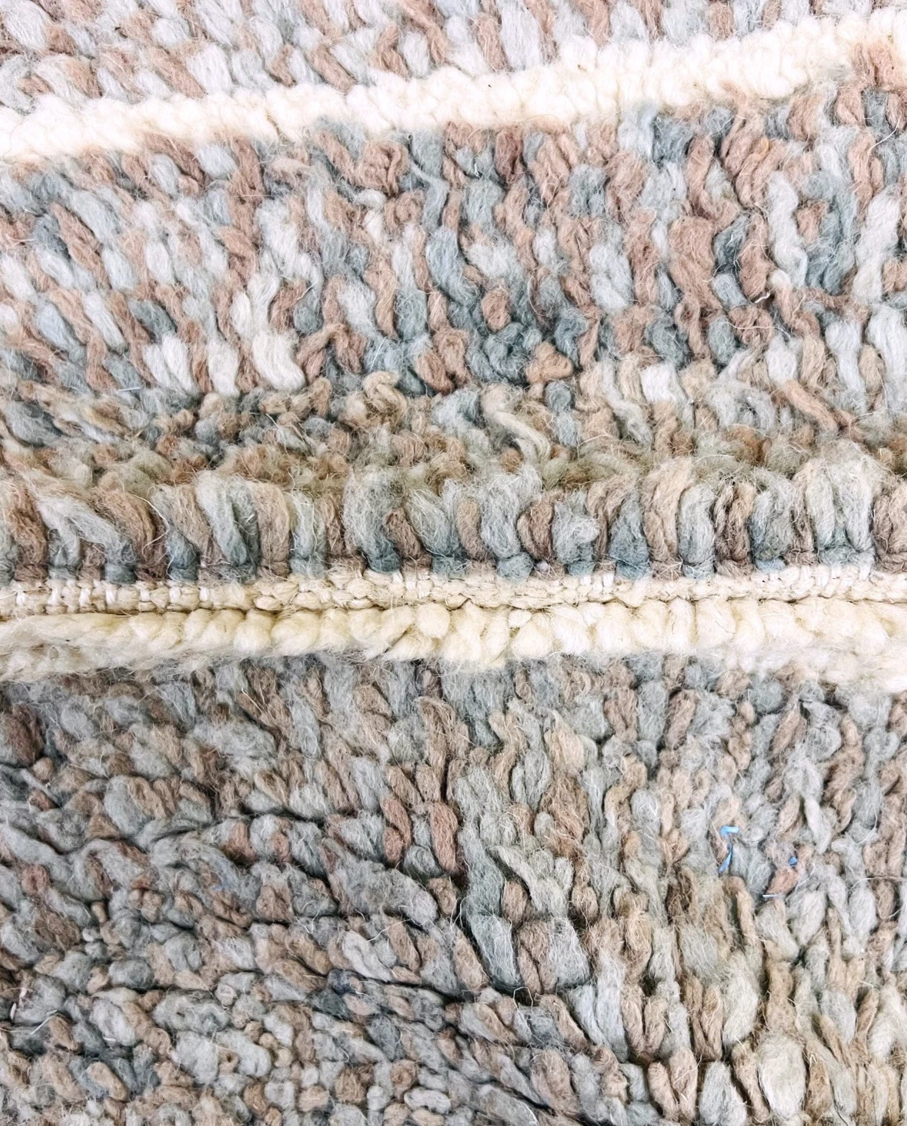 NESRINE Beni Ourain taupe broken stripe Moroccan rug close-up showing hand-knotted wool texture and pile detail 2, by NURA