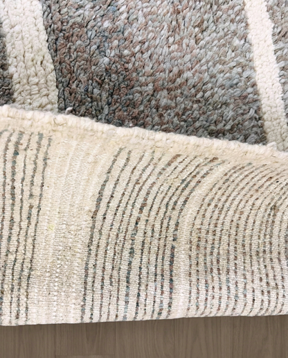 NESRINE Beni Ourain taupe broken stripe Moroccan rug close-up showing hand-knotted wool texture and pile detail 3, by NURA