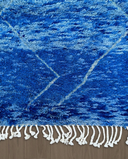 NOUHA Beni Ourain cobalt diamond lattice Moroccan rug close-up of hand-tied fringe and kilim band detail, by NURA