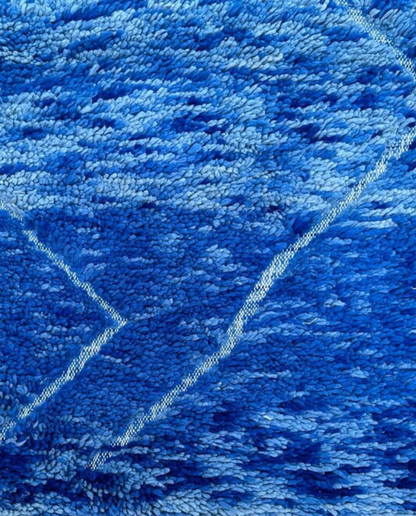 NOUHA Beni Ourain cobalt diamond lattice Moroccan rug close-up showing hand-knotted wool texture and pile detail 1, by NURA