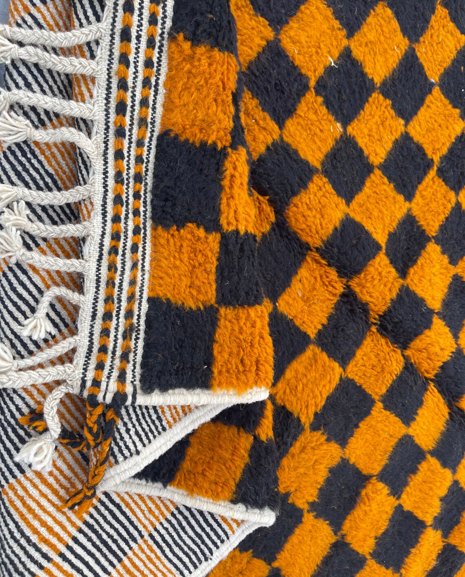 NOUHAILA Beni Ourain burnt orange bold checkerboard Moroccan rug back view showing traditional handwoven construction, by NURA