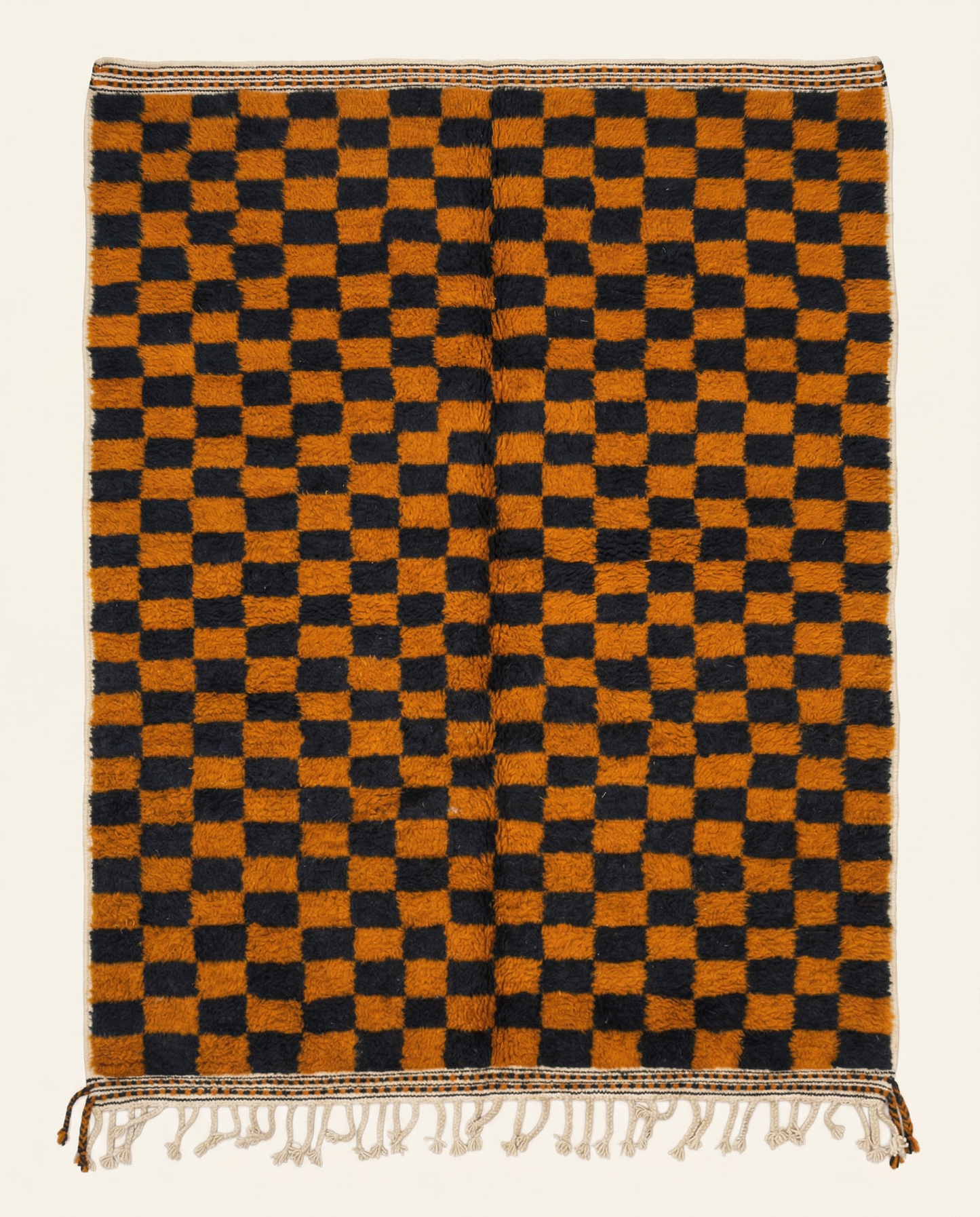Plush burnt orange and black Beni Ourain Moroccan rug with a bold checkerboard pattern and high pile, by NURA.