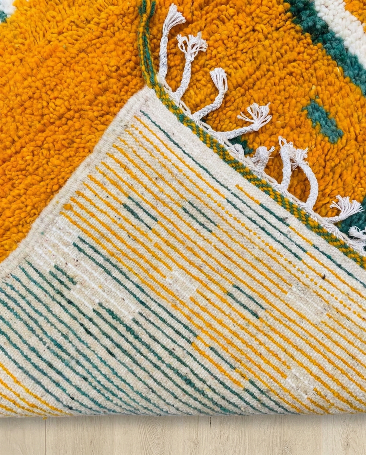 NOUR Beni Ourain saffron striped framed field Moroccan rug back view showing traditional handwoven construction, by NURA