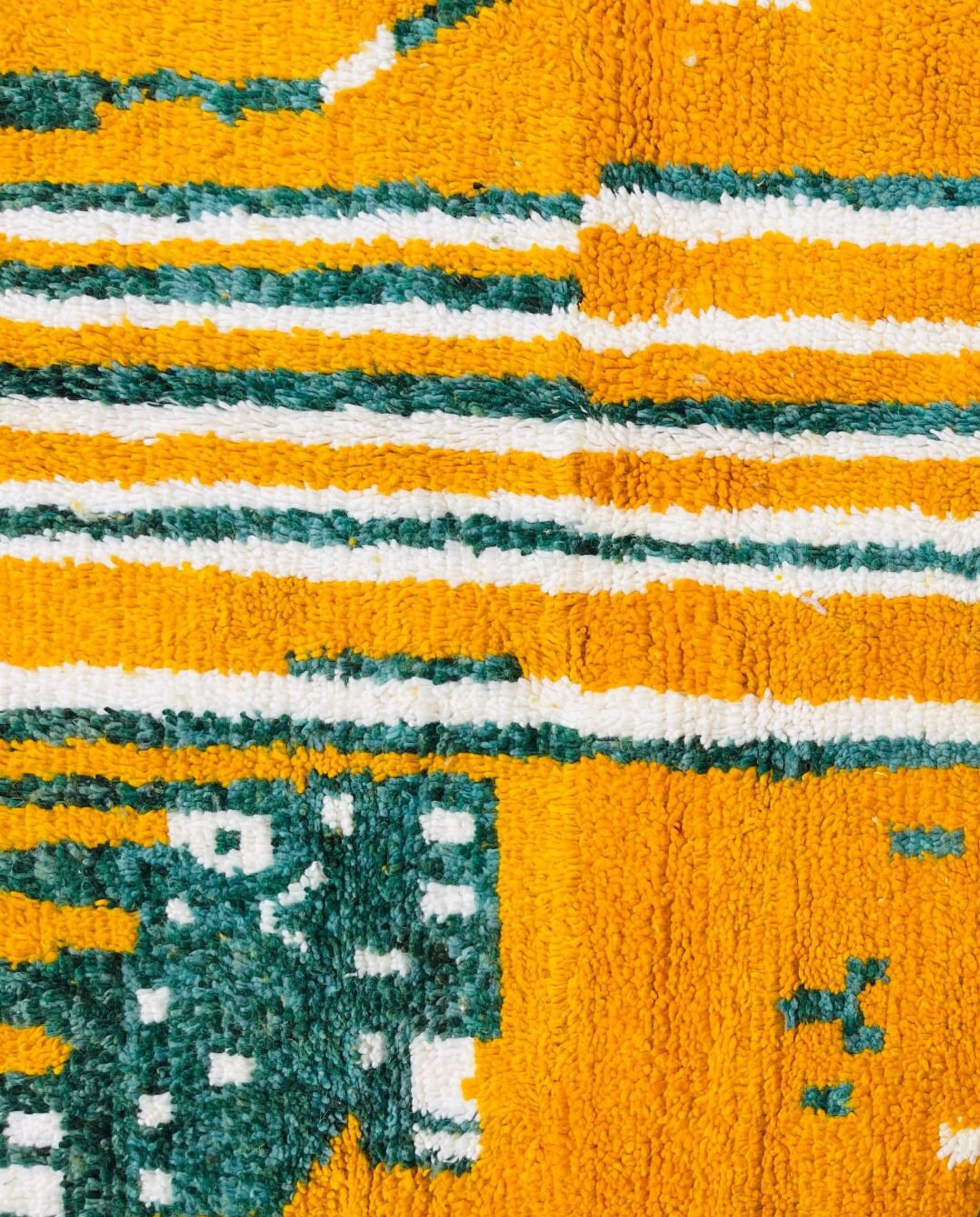 NOUR Beni Ourain saffron striped framed field Moroccan rug close-up showing hand-knotted wool texture and pile detail, by NURA