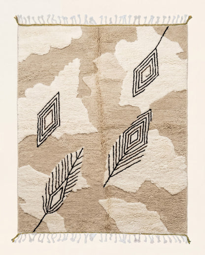Plush Beni Ourain Moroccan rug featuring organic cream shapes and dark geometric diamond motifs on a warm beige wool pile by NURA.