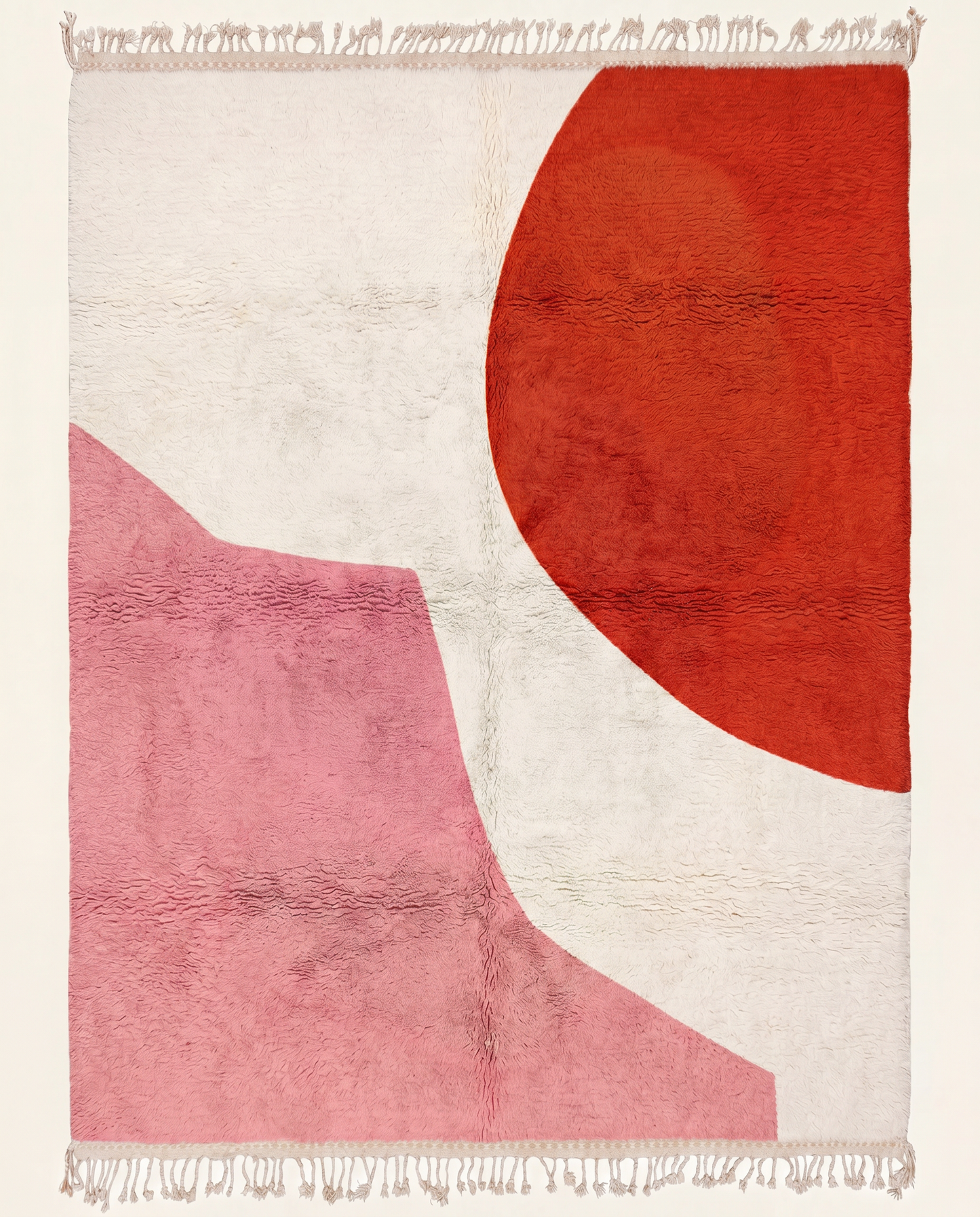 A contemporary Moroccan rug featuring a bold red circle and pink abstract shape on a plush cream wool field, by NURA.