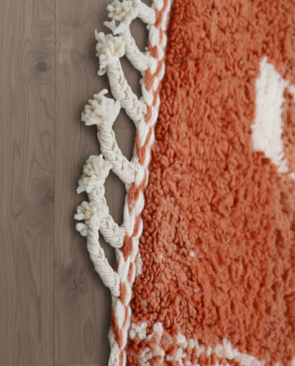 NUJA Boujad terracotta organic abstract Moroccan rug close-up of hand-tied fringe and kilim band detail 2, by NURA